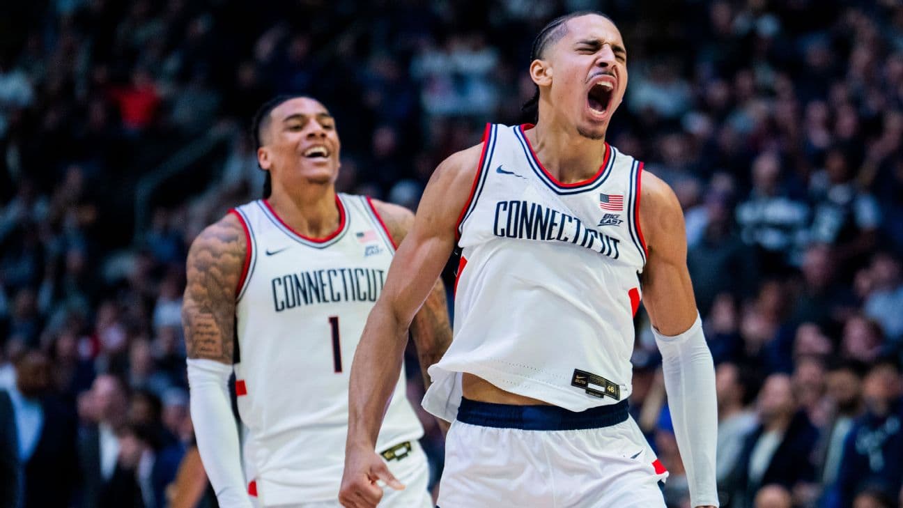 UConn basketball players celebrating during a game